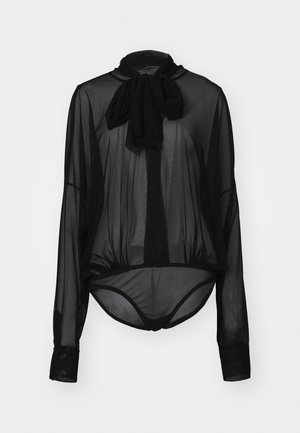 Black sheer blouse with long sleeves and a bow tie neckline. Features a fitted bottom hem and textured fabric.