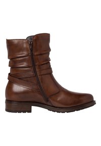 Brun läderankelboot med en slouchig design, sidodragkedja och remdetaljer. Har en låg blockklack och strukturerad yta.