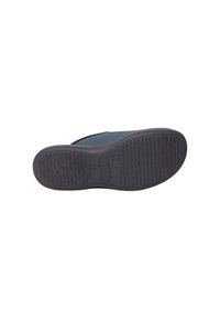 Suola di scarpa in gomma nera con texture rigata, forma leggermente arrotondata e dettaglio del logo circolare. Taglia 40 contrassegnata sul lato.