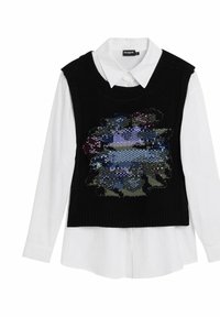 Schwarze gestrickte Sweaterweste mit einem farbenfrohen, mit Pailletten besetzten abstrakten Design, das über einem weißen Hemd mit Kragen getragen wird. Lange Ärmel sind sichtbar.