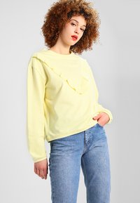 Urban Classics LADIES TERRY VOLANT CREW - Mikina - powderyellow
