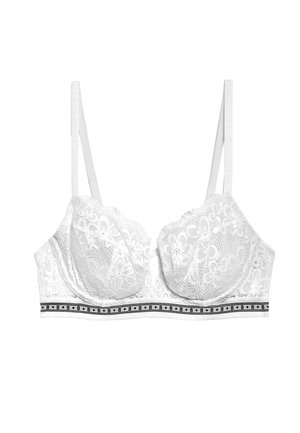 Reggiseno bianco in pizzo con ferretto e spalline regolabili. Caratterizzato da un design in pizzo floreale, una fascia bianca solida con dettagli neri e cuciture decorative.