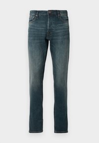 Slim-fit tumši zilie džinsi ar klasisko piecu kabatu dizainu, ar pogu un rāvējslēdzēju, ar maigu izbalējumu un taisnu kāju.