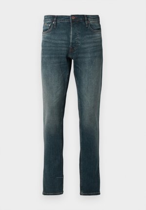 Jeans de denim escuros, slim-fit, com um design clássico de cinco bolsos, apresentando um fecho de botão e zíper, desbotamento discreto e perna reta.