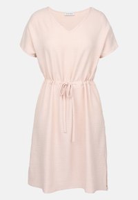 Light pink short-sleeve dress with a V-neck, elastic waist, and adjustable drawstring. Soft, textured fabric with side slits.