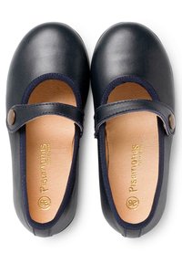 Black leather Mary Jane shoes with rounded toes, elastic strap, and tan leather insoles. Features decorative stitching along the edges.