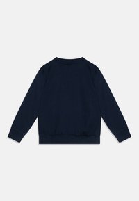 Dark blue pullover sweater made of soft, textured fabric. Features a rounded neckline, long sleeves, and a ribbed waistband and cuffs.
