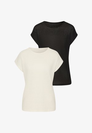 Due magliette a maniche corte, in bianco e nero, realizzate in tessuto texture con un motivo a griglia. Collo rotondo e design loose fit.