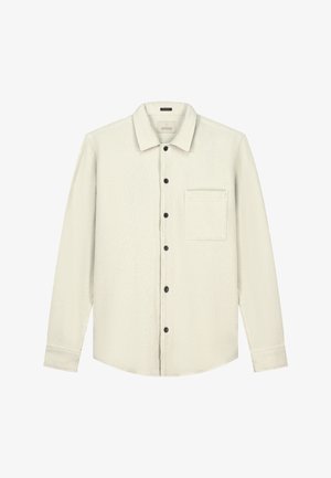 Helles beige Langarmhemd mit strukturiertem Gewebedesign, schwarzen Knöpfen und einer einzelnen Brusttasche. Schlichter Kragen und abgerundeter Saum.