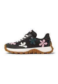 Black athletic shoe with floral patterns in pink and green. Features a white midsole and textured gum rubber outsole. Lace-up design.