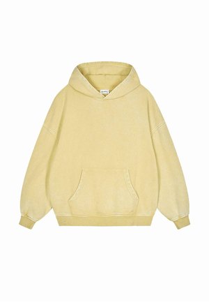 Übergroßer gelber Hoodie aus weichem Material, mit einer Vorderentasche, Kordelzugkapuze und gerippten Bündchen mit kontrastierenden Nähten.