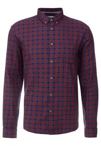 Punainen ja laivastonsininen ruudullinen pitkähihainen paita, jossa on napillinen kaulus, rintatasku ja etupuolella messinkinväriset napit.