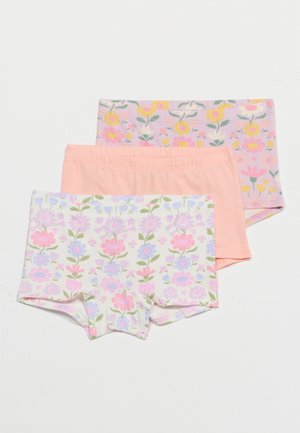 Trois shorts en coton extensible pour filles avec des ceintures élastiques, présentant des motifs floraux dans des couleurs pastel et un uni pêche.