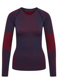 Pitkähihainen saumaton urheilupaita tummansinisessä ja viininpunaisessa, jossa on teksturoituja paneeleja hihoissa ja sivuilla, pyöreä pääntie ja logo rinnassa.