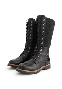 Zwarte leren en wollen veterschoenen met bruine zoolrand en robuuste loopzool, ontworpen voor koud weer.