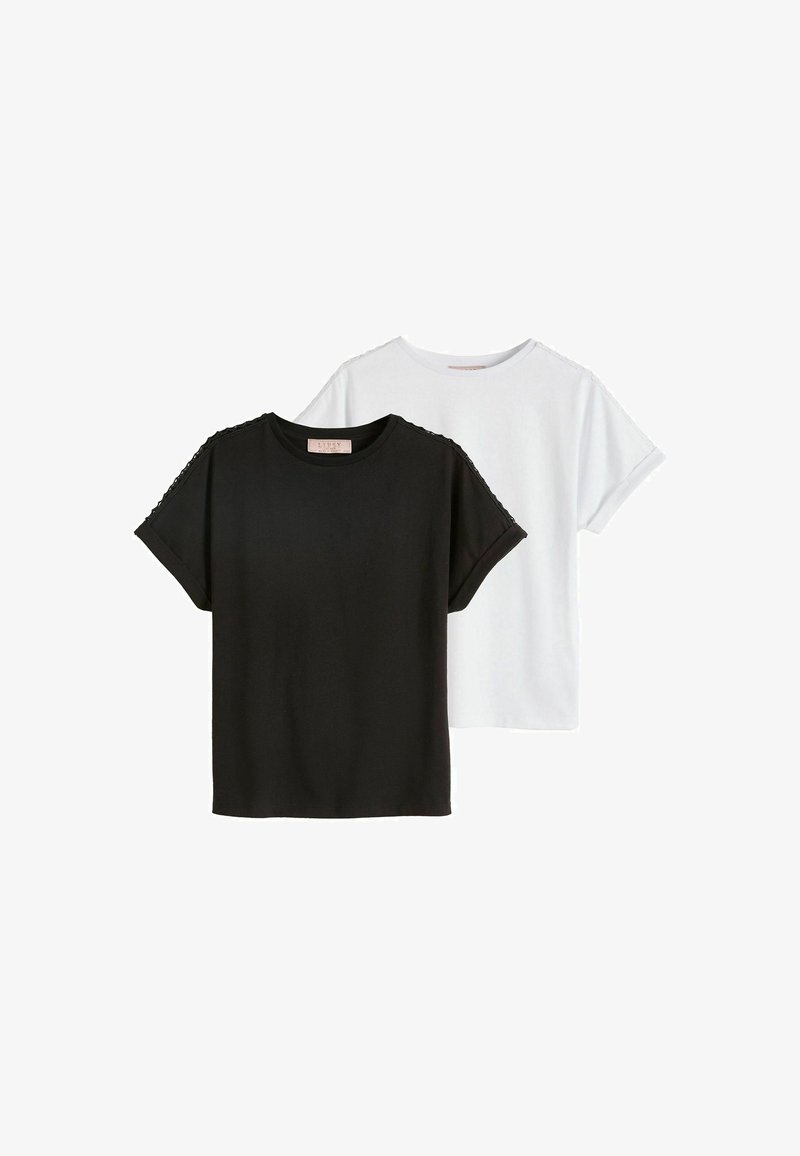 Fekete és fehér, rövid ujjú pamut pólók kerek nyakkivágással és csipkés részletekkel a vállvarrások mentén.