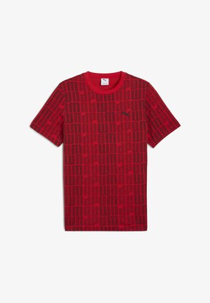Tricou roșu cu mânecă scurtă, având un model texturat de dreptunghiuri negre, prevăzut cu un logo Puma negru pe pieptul stâng. Material din bumbac.