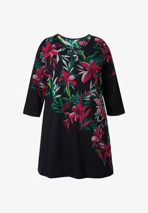 Schwarze Tunika mit dreiviertel Ärmel und lebhafter pink- und grüner Blumenstickerei an einer Seite. Weiche Textur, lockeres Design.