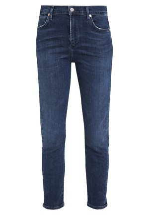 Tummansiniset farkut, joissa on slim fit -malli, viisi taskua, nappisulku ja vaaleat kulutukset saumoissa ja taskuissa.
