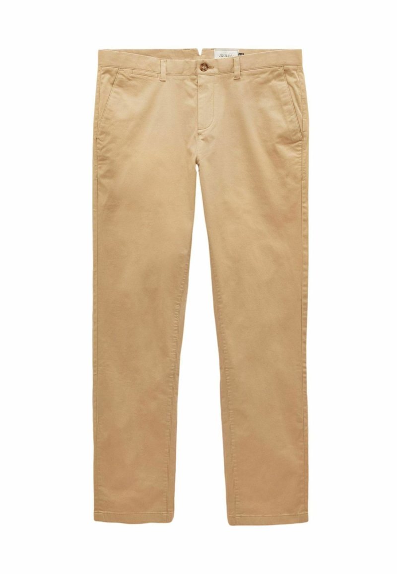 Beżowe bawełniane chinosy o zwężanym kroju, z zapięciem na guzik, dwoma przednimi kieszeniami oraz gładką, lekko teksturowaną powierzchnią.
