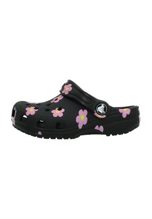 Sabot noir à enfiler avec motifs de fleurs roses et jaunes, trous de ventilation et bride réglable avec un bouton logo rond.