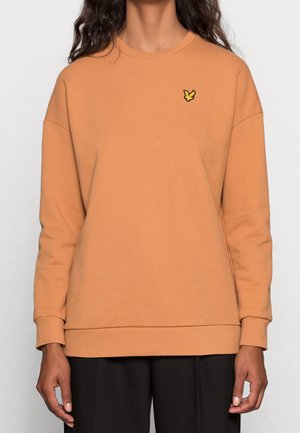 Sweatshirt orange à col rond, coupe décontractée, poignets côtelés et un petit logo d'oiseau jaune sur la poitrine. Finition en textile doux.