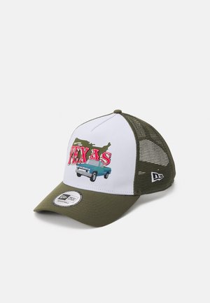 Green and white trucker cap featuring a colorful "Greetings from Texas" graphic, with a mesh back and curved brim.