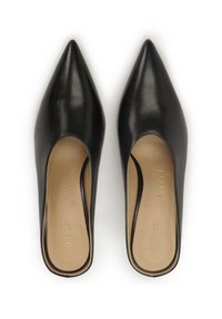 Black leather mules with pointed toes, open sides, smooth texture, and a beige insole. Features a subtle brand imprint on the inner sole.