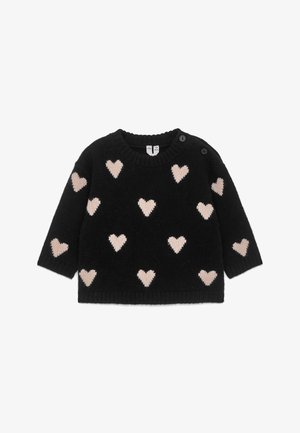 Pull en maille noir à manches longues avec des motifs de cœurs rose pâle et deux boutons noirs sur le col de l'épaule gauche.