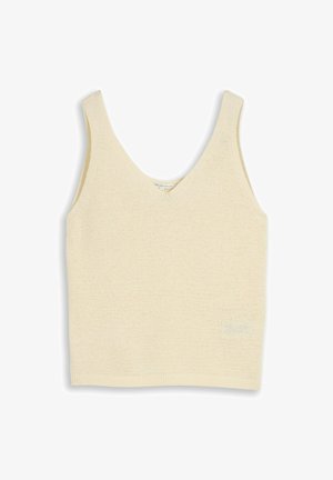 Débardeur en tricot couleur crème sans manches avec col en V et ourlet côtelé, posé à plat sur un fond blanc.