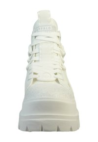 White high-top sneaker featuring a textured upper with subtle glitter, flat laces, and a chunky rubber sole with a patterned tread.