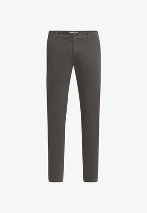 Halli puuvillased chinosid, mis on kitsas lõikega. Omab peidetud lõppkinnitust ja nööri. Sile tekstuur, ilma nähtavate mustrite või aktsentideta.