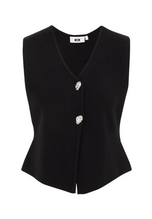 Melna adīta bez piedurknēm veste ar V veida kakla izgriezumu, ar pogu aizdari, kas izgatavota no sudrabainas materiāla, un izplestu apakšmalu.