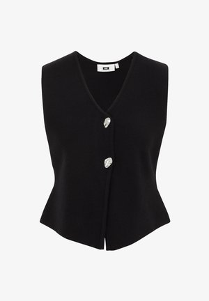 Melna adīta bez piedurknēm veste ar V veida kakla izgriezumu, ar pogu aizdari, kas izgatavota no sudrabainas materiāla, un izplestu apakšmalu.