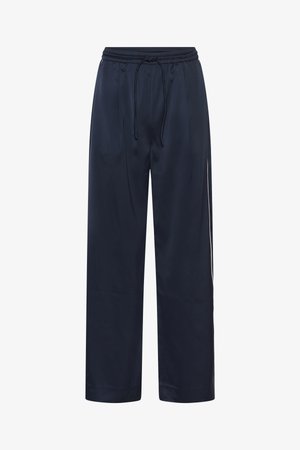 Luźne spodnie w kolorze granatowym z gładkiego materiału, z elastycznym pasem i sznurkiem oraz bocznymi kieszeniami dla wygody.