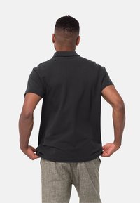 Jack Wolfskin ESSENTIAL - Polo - black