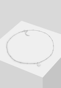 Silver chain necklace with delicate bead accents and a crescent moon charm. Features an adjustable clasp for length customization.