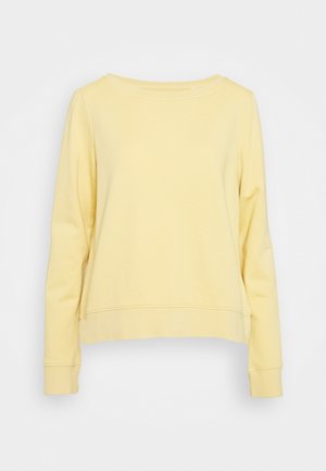 Effen lichtgele sweater met lange mouwen en een ronde hals, getoond op een witte achtergrond, zonder zichtbare logo's of patronen.