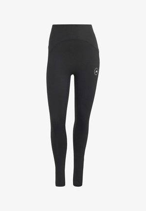 Leggings negras de cintura alta y largo completo con detalles de costuras y pequeño logo circular de Adidas by Stella McCartney en la parte superior del muslo.