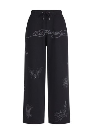 Schwarze Hose mit weitem Bein und Kordelzugbund, mit grauem Ed Hardy-Logo und tattooartigen Designs, darunter ein Schädel, ein Spinnennetz und ein Adler.
