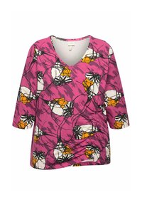 Rosa Bluse mit floralem Muster, V-Ausschnitt und drei Viertelärmeln. Gerafftes Seitendetail mit schwarzen Umrandungen und orangefarbenen Akzenten.