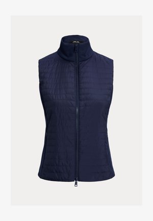 Tengerészkék ujjatlan mellény magas gallérral, steppelt textúrával és teljes hosszúságú elülső cipzárral. Oldalzsebekkel és sima anyaggal rendelkezik.