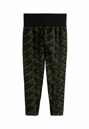 Roheline kamuflaažiga retuusid musta elastse vöökohtaga, sujuva kangastekstuuri ja vormitud disainiga.