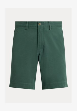 Temno zelene kratke hlače do kolen z zankami za pas, zapiranjem na gumb in našitim robom na enobarvnem ozadju.