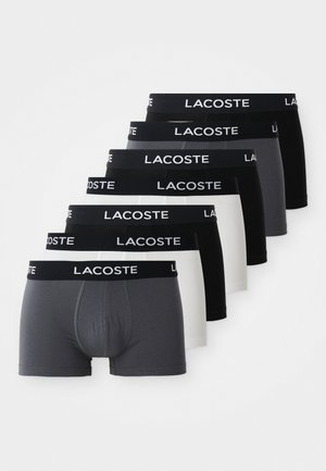 Conjunto de seis pares de calzoncillos tipo boxer Lacoste en gris, negro y blanco, con una cinturilla con logo, material de algodón y diseño ajustado.