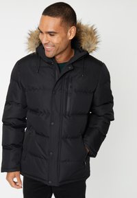 Czarna kurtka puchowa z kapturem wykończonym sztucznym futrem. Posiada zamek błyskawiczny oraz guziki z przodu, dwie boczne kieszenie oraz ocieplające wypełnienie dla zapewnienia ciepła.