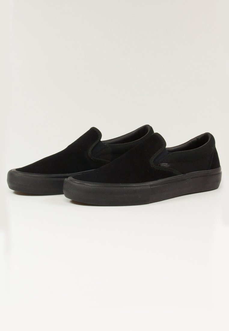 vans black sole slip on