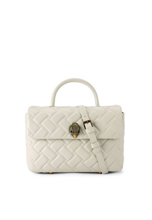 Quilted cream leather handbag with a top handle and detachable shoulder strap. Features a gold-tone clasp shaped like a hand.
