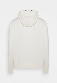 Krämfärgad hoodie med dragsko i huven, ribbade ärmslut och nederkant. Tillverkad av mjukt tyg med en slät yta, med en enkel design.