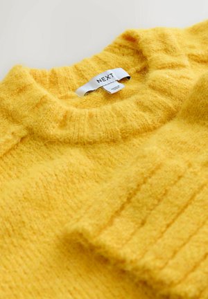 Gelber, gestrickter Pullover mit strukturiertem Finish, ausgestattet mit einem Rundhalsausschnitt und gerippten Bündchen. Das Etikett trägt die Aufschrift "NEXT". Weiche, voluminöse Optik.